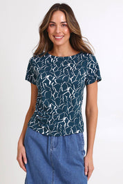 Model Madelinec wearing size 10 of the Victoria Viscose Tee – Teal in colour Teal, in a cropped view