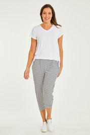 Model Georgia wearing size 10 of the Tokyo Stretch 3/4 Pant in colour Noirstripe (Black), from the front, showing the whole outfit