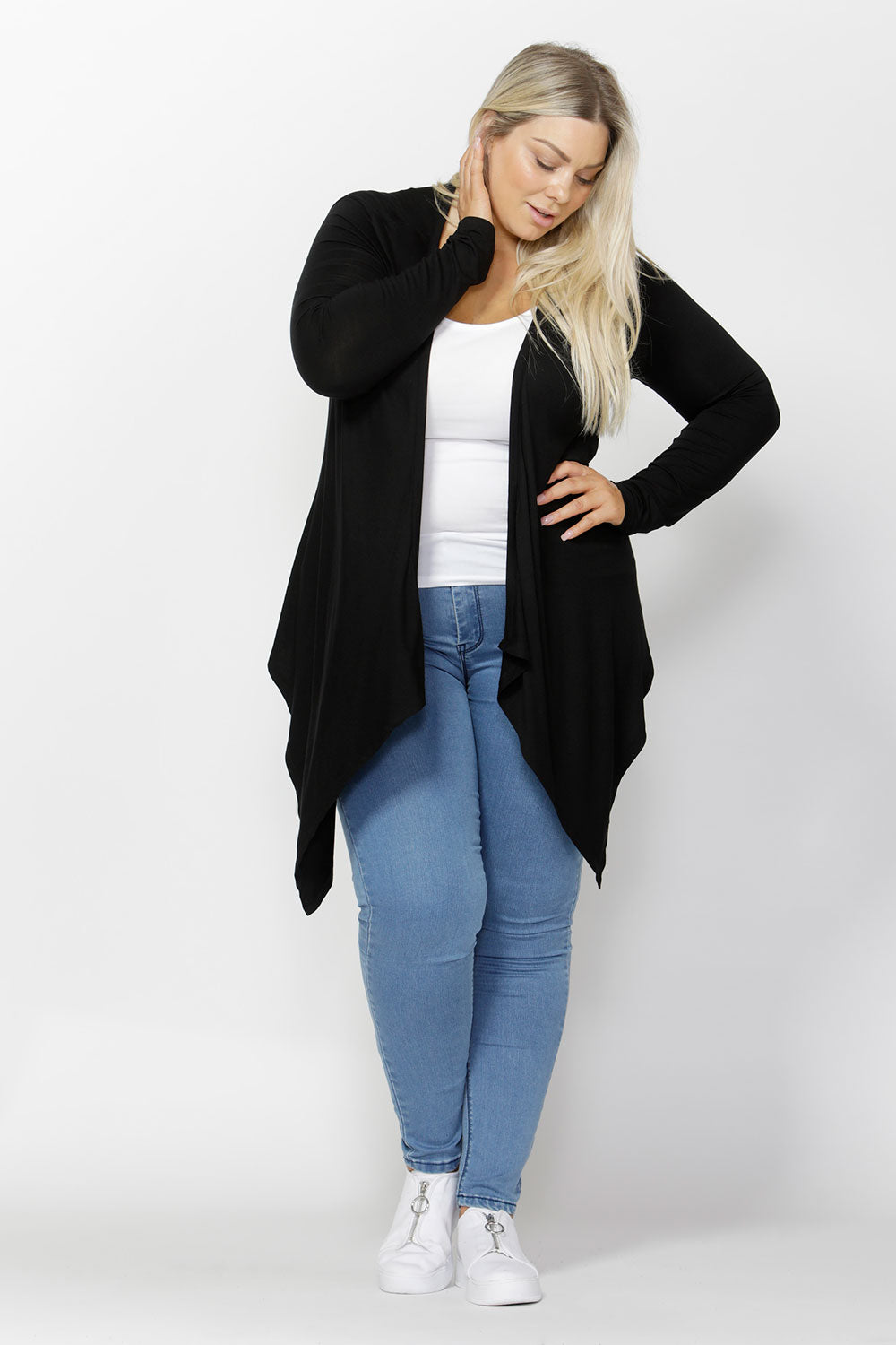 A model wearing the Melbourne Stretch Cardigan in colour Black (Black), from the front, showing the whole outfit
