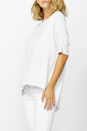 A model wearing the Wellington Tee in colour HeatheGrey (Grey), from the front, cropped image