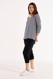 A model wearing the Milan 3/4 Sleeve Top in colour Nutmegstr, from the front, showing the whole outfit