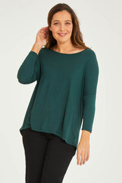 Model Georgia wearing size 10 of the Milan Stretch Top in colour Ivy (Green), from the front, cropped image