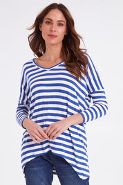 Model Madeline wearing size 10 of the Geneva Tee in colour Whitestrip (White), from the front, cropped image