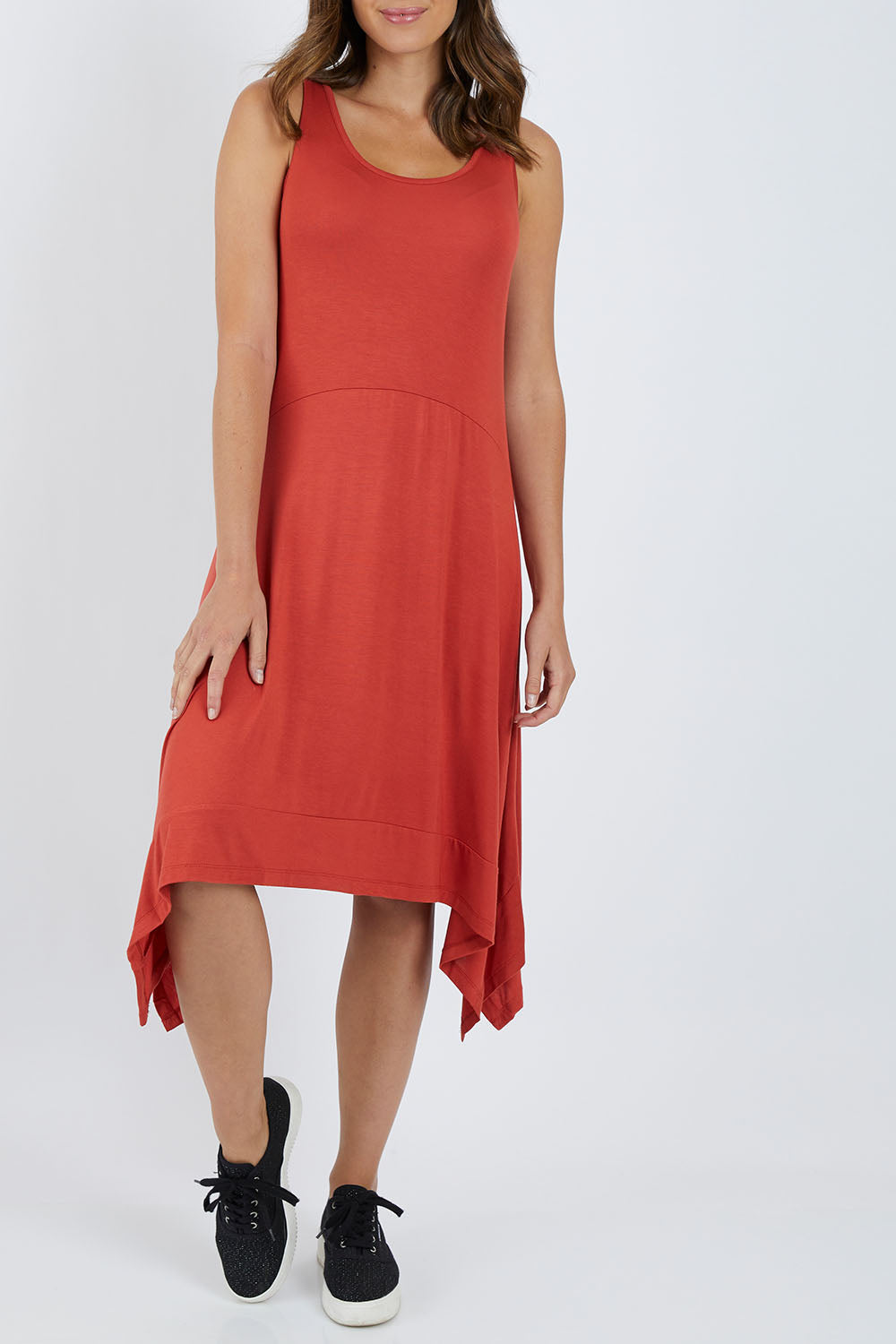 Model Madeline wearing size 10 of the Madrid Dress in colour Sunset, from the front, cropped image