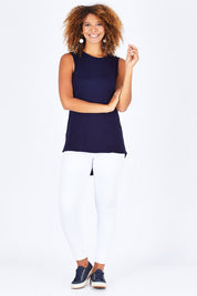 Model Summer wearing size 10 of the Capri Tank in colour Navy (Blue), from the front, showing the whole outfit