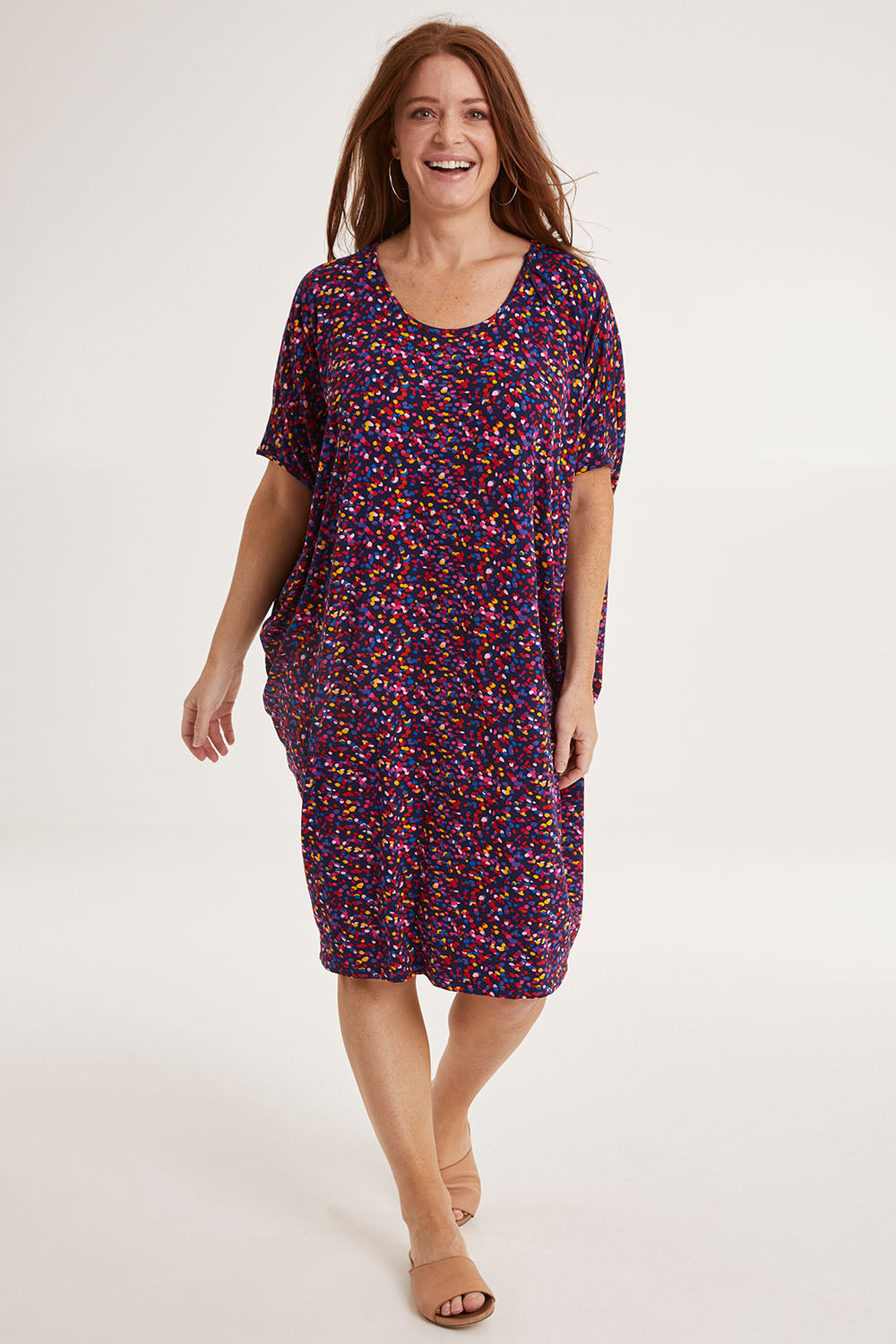 Model Sally wearing size 10 of the Maui Dress in colour Confetti (Blue), from the front, showing the whole outfit