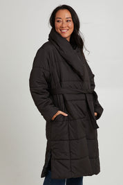 Model Katie wearing size 10 of the Shawl Puffer Jacket in colour Black (Black), from the front, cropped image