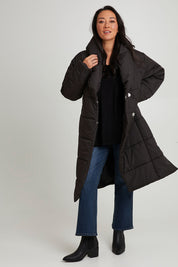 Model Katie wearing size 10 of the Shawl Puffer Jacket in colour Black (Black), from the front, showing the whole outfit