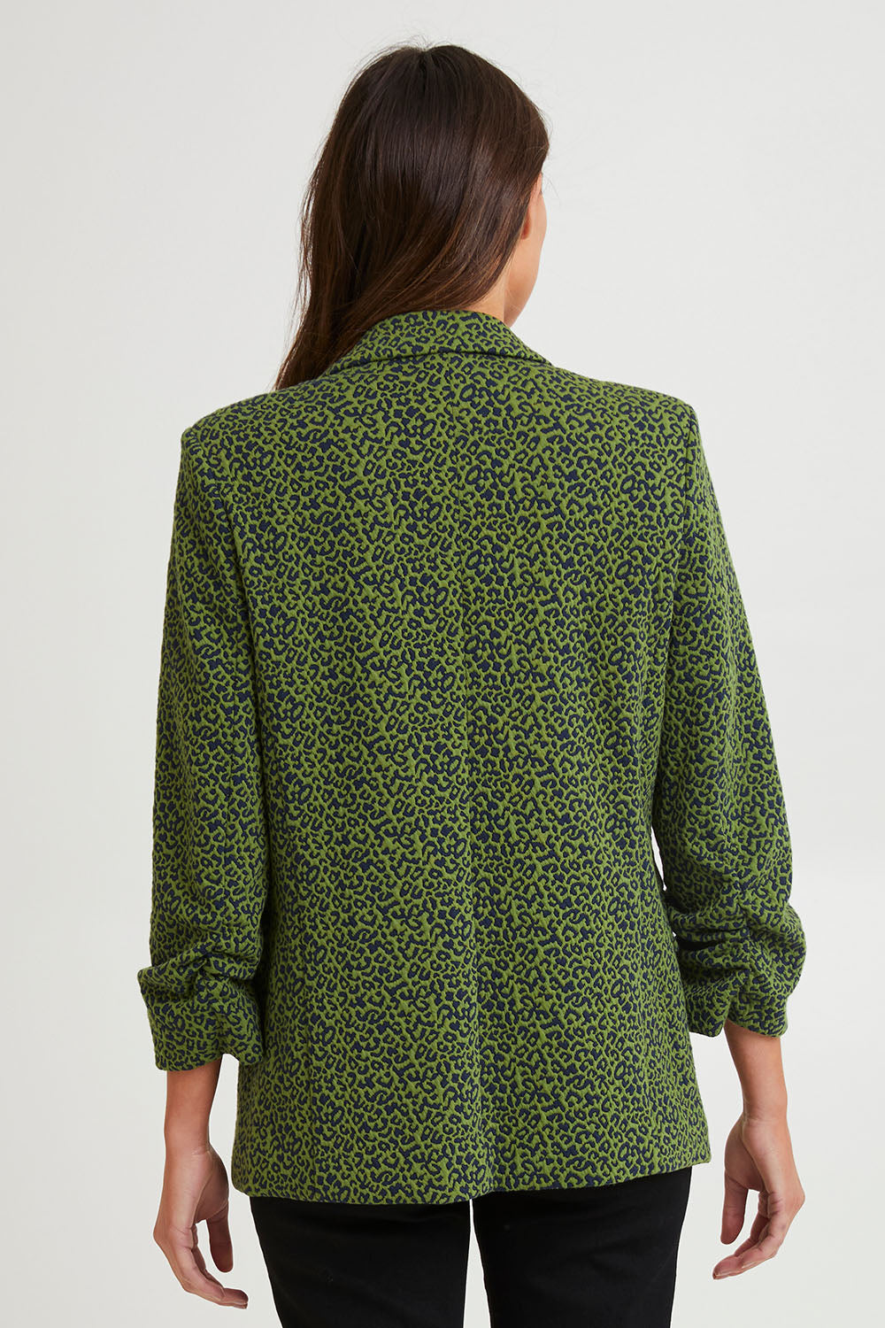 Model Madeline wearing size 10 of the Leopard Jacquard Blazer in colour Leopard (Green), from the back