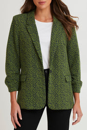 Model Madeline wearing size 10 of the Leopard Jacquard Blazer in colour Leopard (Green), from the front, cropped image