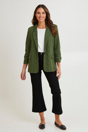 Model Madeline wearing size 10 of the Leopard Jacquard Blazer in colour Leopard (Green), from the front, showing the whole outfit