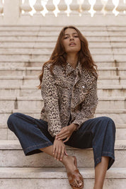 A model wearing the Lucca Leopard Print Jacket in colour Leopard, from the front, showing the whole outfit