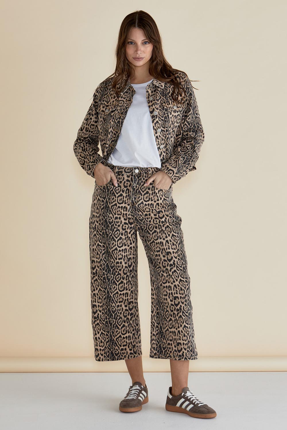 A model wearing the Lucca Leopard Print Jacket in colour Leopard, from the front, showing the whole outfit