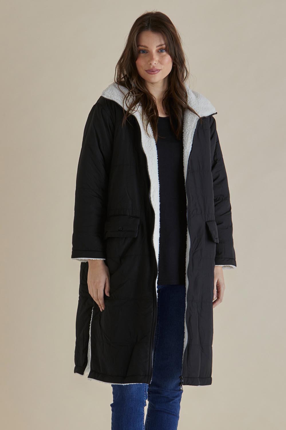 A model wearing the Valkyrie Puffer Jacket in colour Black (Black), from the front, cropped image
