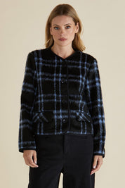 A model wearing the Charlie Check Coat in colour Bluecheck (Blue), from the front, cropped image