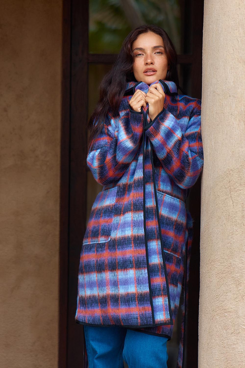A model wearing the Oslo Coat in colour Purple (Purple), from the front, showing the whole outfit