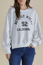 A model wearing the Mykie Cotton Blend Jumper in colour Print (White), from the front, cropped image