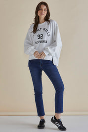 A model wearing the Mykie Cotton Blend Jumper in colour Print (White), from the front, showing the whole outfit