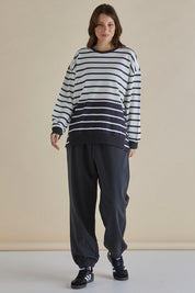 A model wearing the Easy Crew Cotton Sweat in colour Blkwhite, from the front, showing the whole outfit