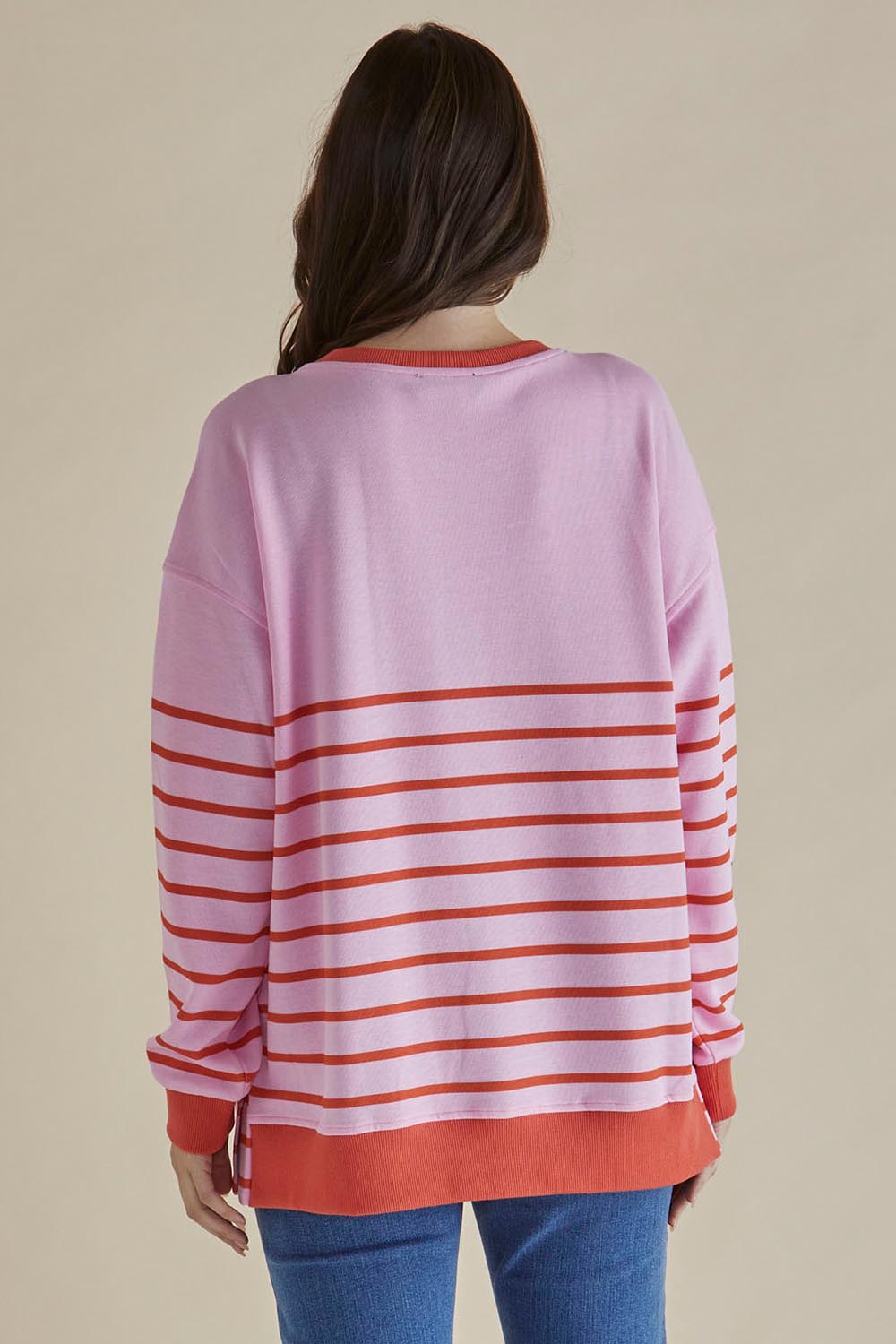 A model wearing the Easy Crew Cotton Sweat in colour Pinkorang (Pink), from the back