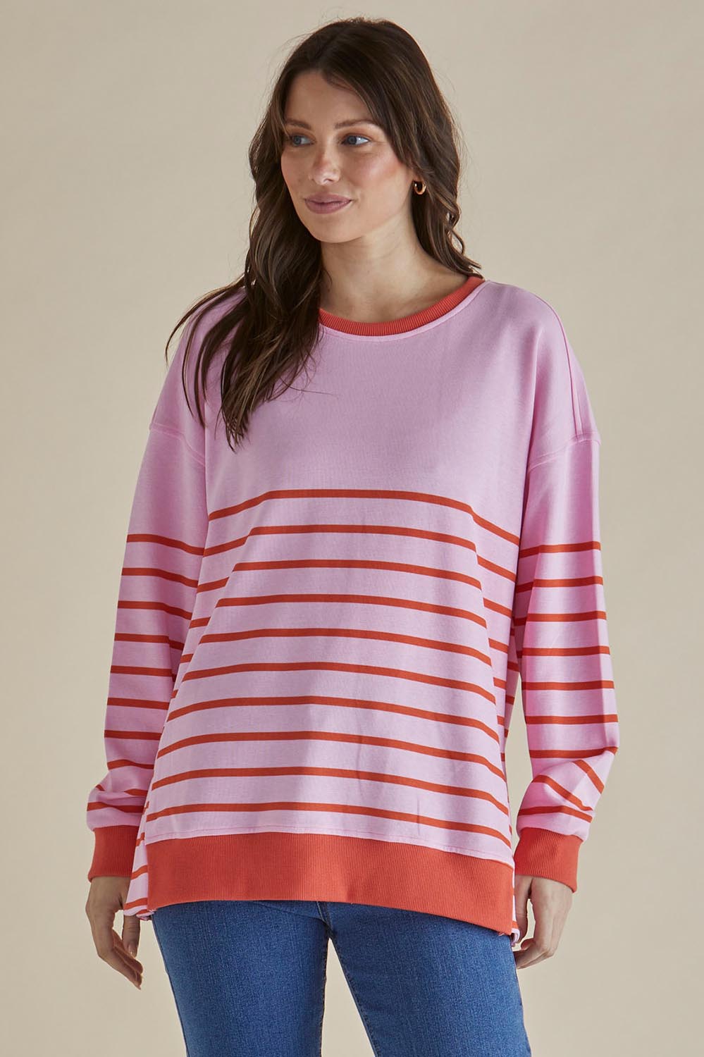 A model wearing the Easy Crew Cotton Sweat in colour Pinkorang (Pink), from the front, cropped image