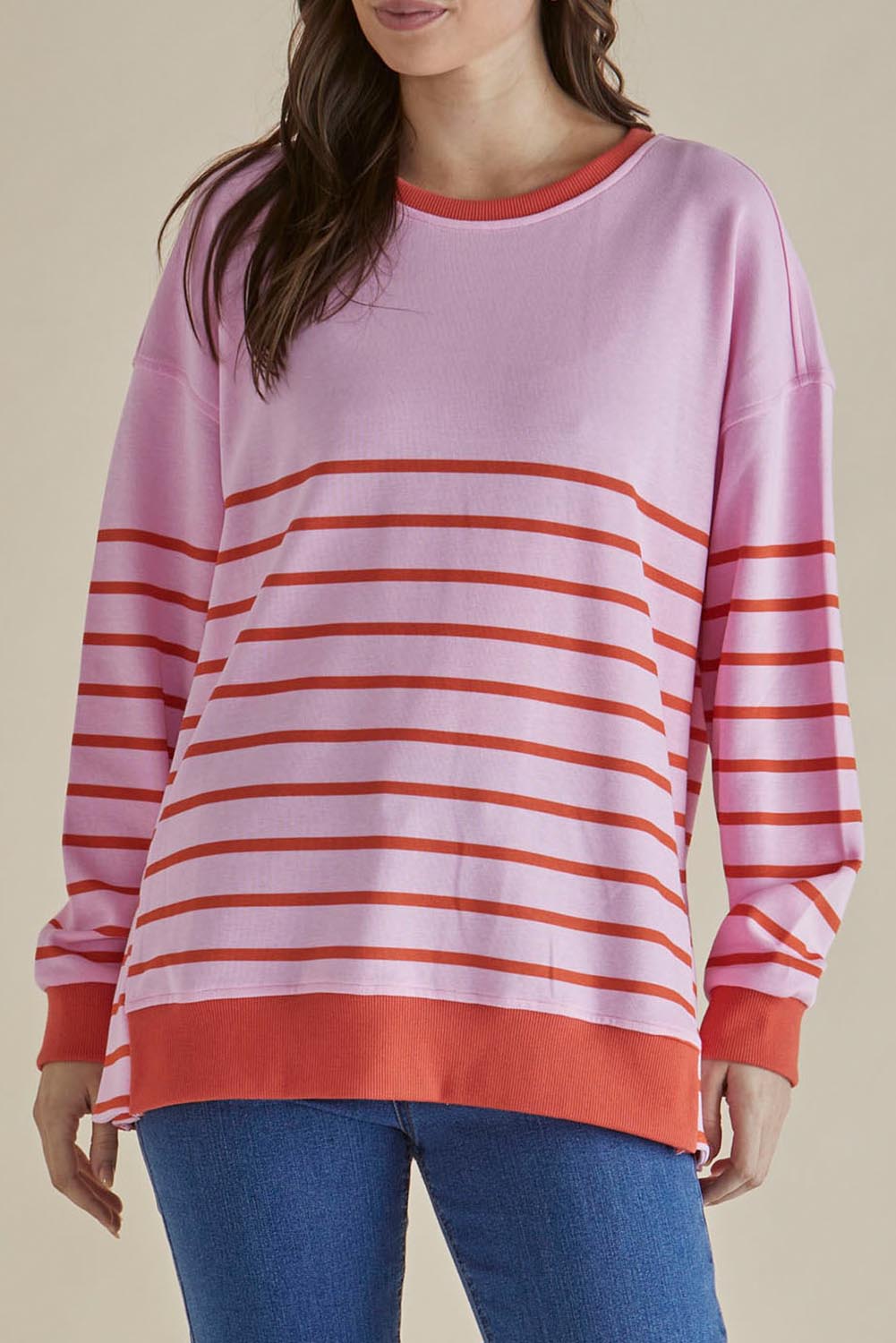 A model wearing the Easy Crew Cotton Sweat in colour Pinkorang (Pink), from the front, cropped image