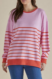 A model wearing the Easy Crew Cotton Sweat in colour Pinkorang (Pink), from the front, cropped image