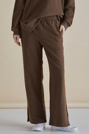 A model wearing the Pace Cotton Jogger in colour Chocolate, from the front, cropped image