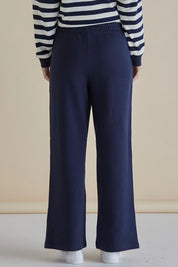 A model wearing the Pace Cotton Jogger in colour Navy (Blue), from the back
