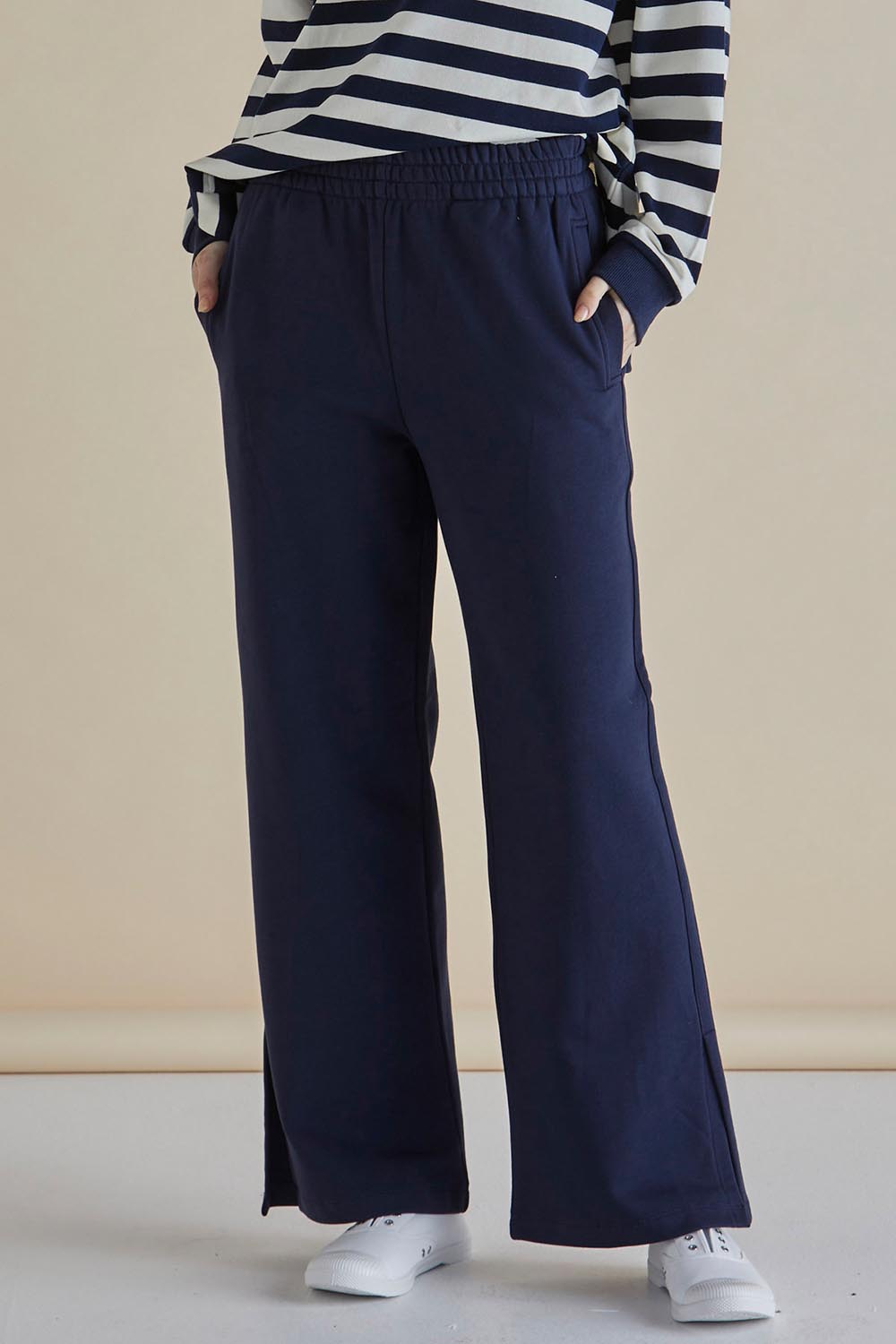 A model wearing the Pace Cotton Jogger in colour Navy (Blue), from the front, cropped image