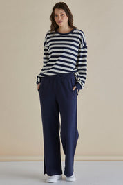 A model wearing the Pace Cotton Jogger in colour Navy (Blue), from the front, showing the whole outfit