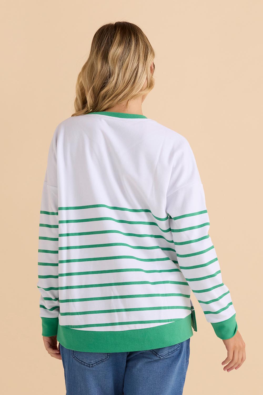 A model wearing the Palma Sweat in colour Green (Green), from the back