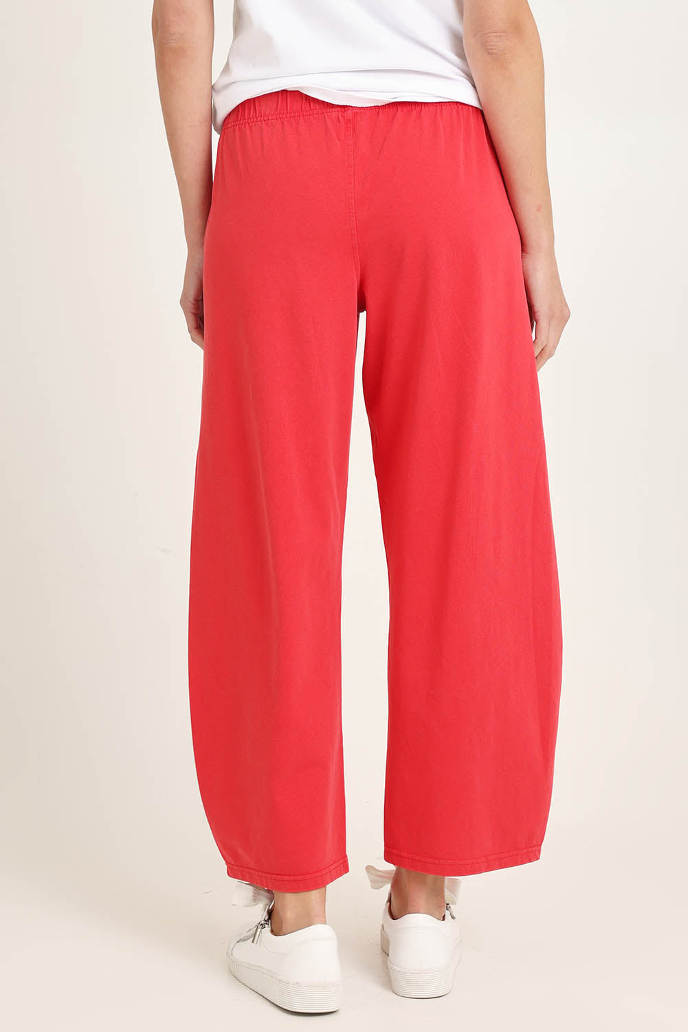 Model Madeline wearing size 10 of the Barrel Leg Cotton Sweatpant in colour Red (Red), from the back