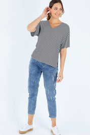 Model Madeline wearing size 10 of the Malta Tee in colour Blkwhite (Black), from the front, showing the whole outfit
