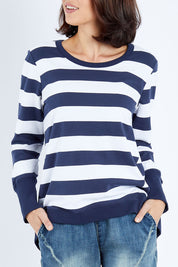 Model Andrea wearing size 10 of the Dolly Sweat in colour Navywhite (Blue), from the front, cropped image