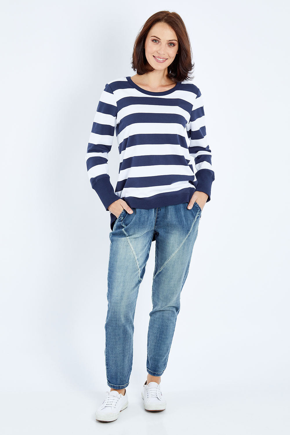 Model Andrea wearing size 10 of the Dolly Sweat in colour Navywhite (Blue), from the front, showing the whole outfit