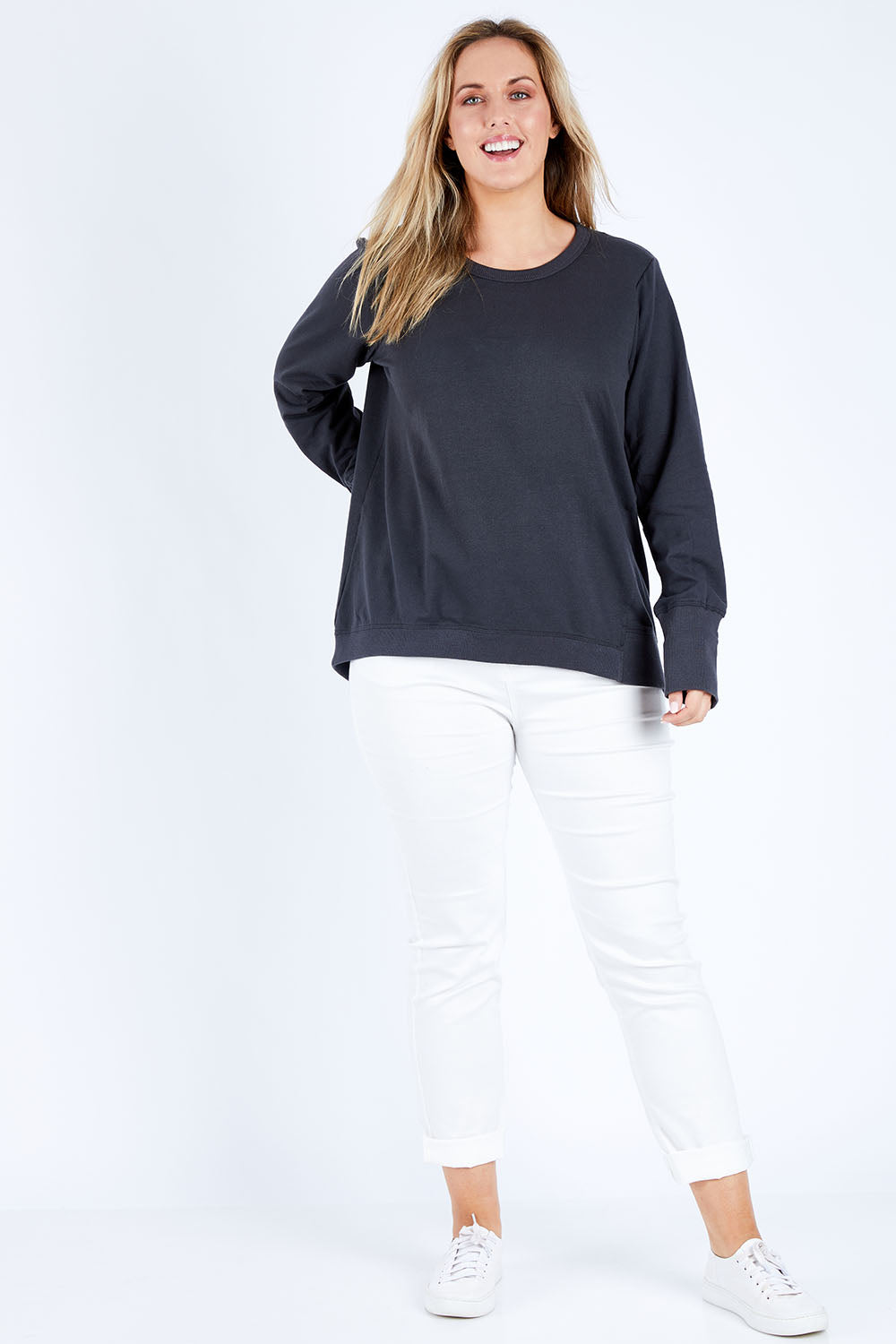 Model Jess wearing size 14 of the Dolly Sweat in colour Gunmetal (Grey), from the front, showing the whole outfit