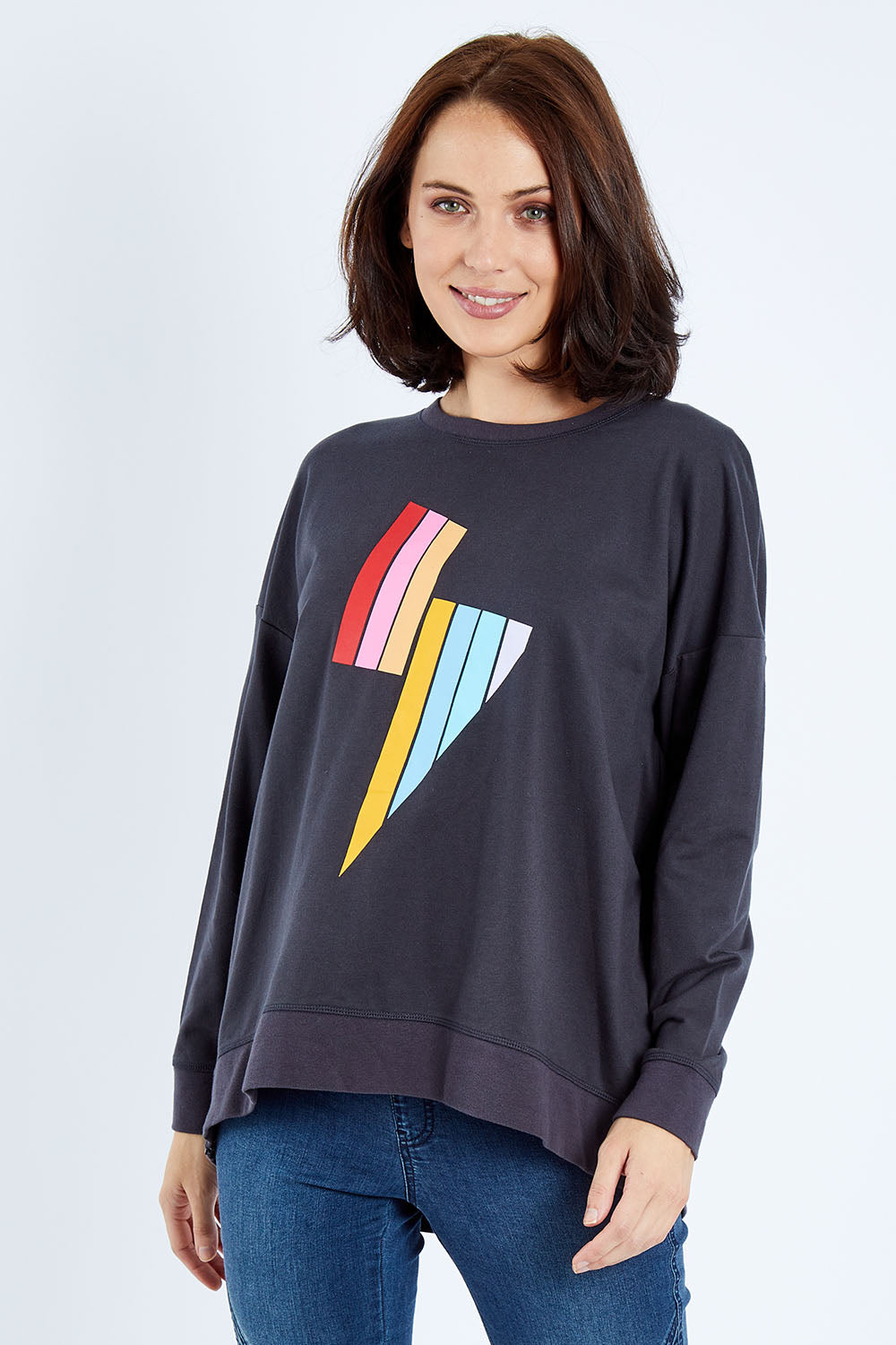 Model Andrea wearing size 10 of the Poppy Sweat in colour Bolt (Grey), from the front, cropped image