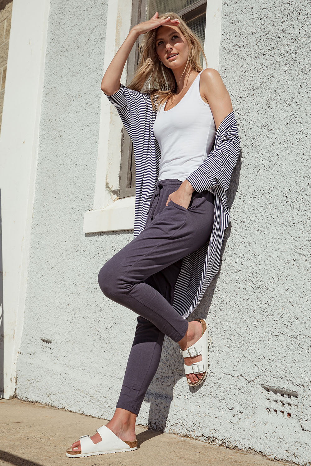 A model wearing the Marissa Jogger in colour Indiblue (Blue), from the front, showing the whole outfit