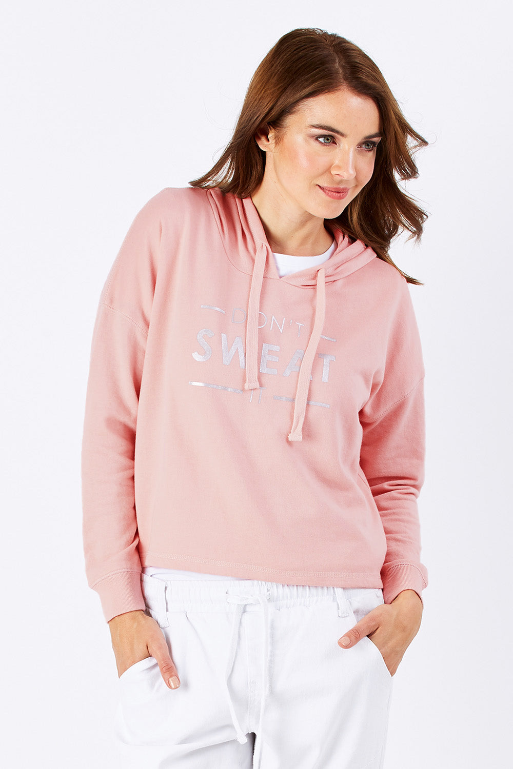 Model Rebecca wearing size 10 of the Oscar Hoodie in colour Blossom (Pink), from the front, cropped image