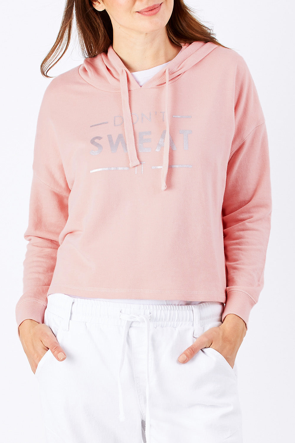 Model Rebecca wearing size 10 of the Oscar Hoodie in colour Blossom (Pink), from the front, showing the whole outfit