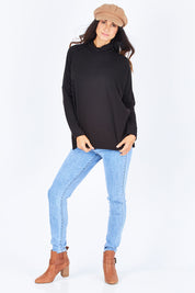 Model Gemma wearing size 10 of the Ivy Cosy Pullover in colour Black (Black), from the front, showing the whole outfit