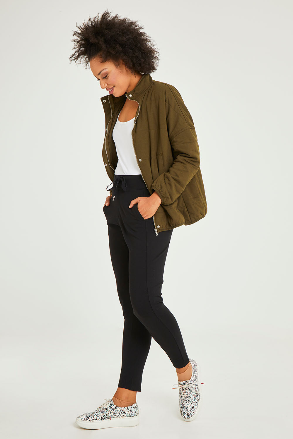 Model Olivia wearing size 10 of the Leo Ponte Jogger in colour Black (Black), from the front, showing the whole outfit