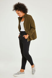 Model Olivia wearing size 10 of the Leo Ponte Jogger in colour Black (Black), from the front, showing the whole outfit