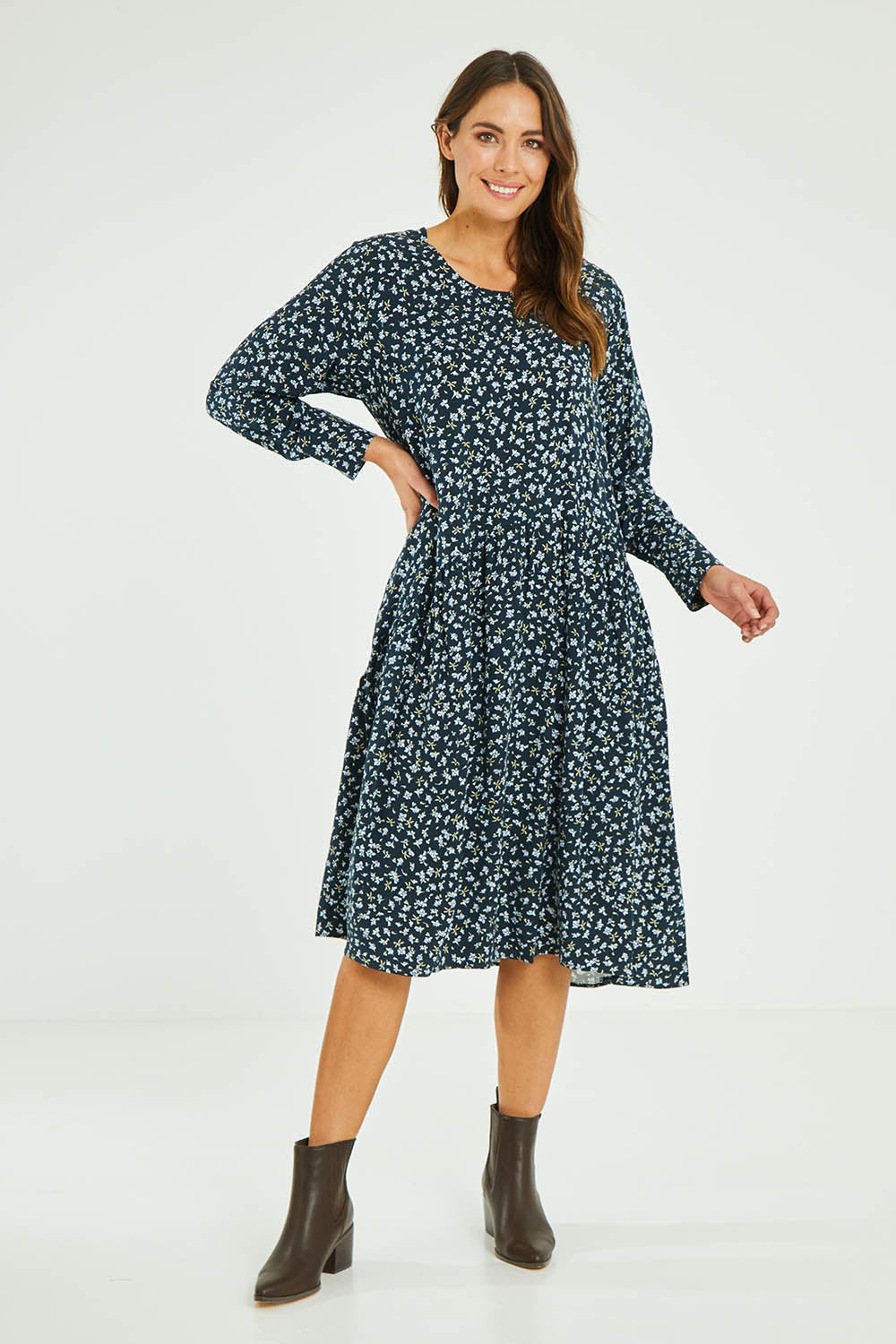 Model Madeline wearing size 10 of the Sharni Dress in colour Floral (Black), from the front, showing the whole outfit