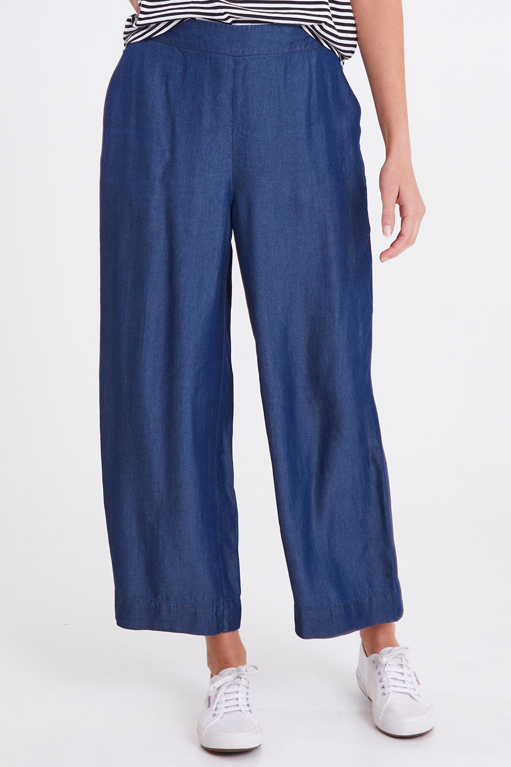 Model Madeline wearing size 10 of the Emily Pant in colour Bluehaze (Blue), from the front, cropped image