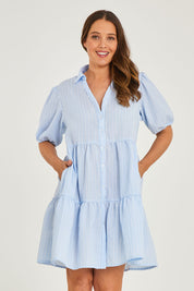 Model Georgia wearing size 10 of the Hayley Dress in colour Blue, from the front, cropped image