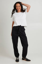 Model Katie wearing size 10 of the Canterbury Lyocell Cargo Pants in colour Charcoal (Black), from the front, showing the whole outfit