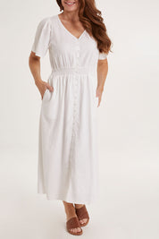 Model Sally wearing size 10 of the Whitney Dress in colour White (White), from the front, cropped image