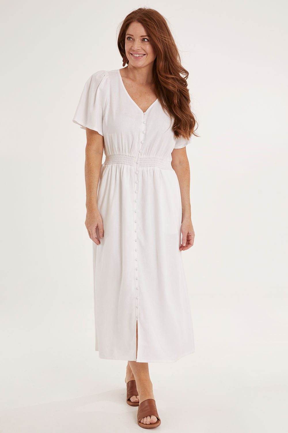 Model Sally wearing size 10 of the Whitney Dress in colour White (White), from the front, showing the whole outfit